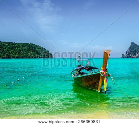 Single Longtail Motor Boat In Andaman Sea Near The Lo Dalam Beach, Phi Phi Don Island, Thailand