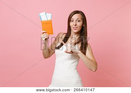 Pretty Bride Woman In Wedding Dress Pointing Index Finger On Passport, Boarding Pass Ticket, Going A