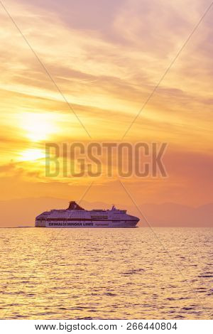 KEFALONIA, GREECE - OCTOBER 22, 2018: Minoan Lines High Speed Ferry Cruise Europa passing Kefalonia island at sunset