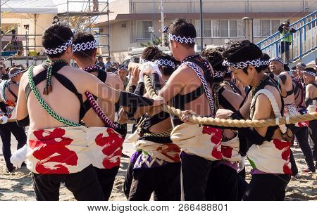 Karatsu, Japan - November 3, 2016: Karatsu Kunchi Festival Participants Pulling Massive Floats Durin
