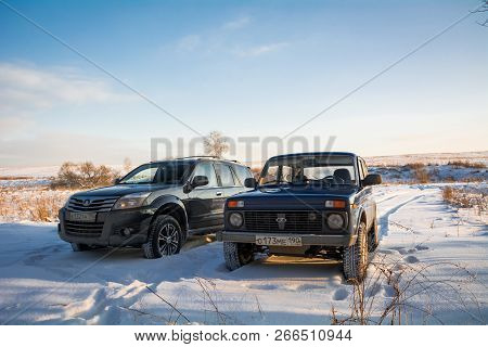 Moscow, Russia - January 26, 2014: Russian Off-road Car Lada Niva And Chinese Suv Great Wall Hover H