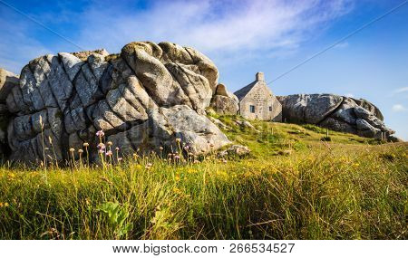 Small medieval watchouse surrounded by the rocks in Meneham, Brittany, France