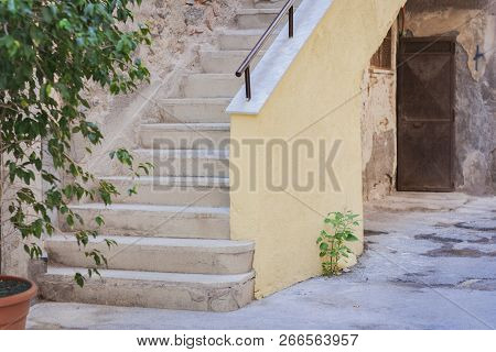Staircase In The Courtyard Of An Old Residential Building, Traditional Architectura Of Catania, Sici