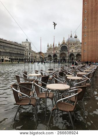 Venice, Italy - 1 November 2018: San Marco square under water, city has been flooded by waters rising 156 cm