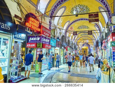 Istanbul, Turkey - July 11, 2018. Tourists At The Passageways Of The Kapali Carsi, The Grand Bazaar 