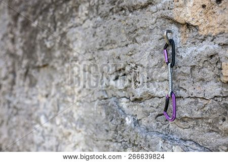 Quickdraw On The Rock. Equipment For Insurance In Mountaineering And Climbing. Carabiner On The Ston