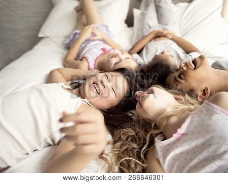Large Group Of Her Friends Taking Goog Time On Bed