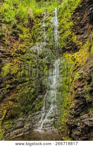 Little Waterfall In Green Summer Mountains, Norway.