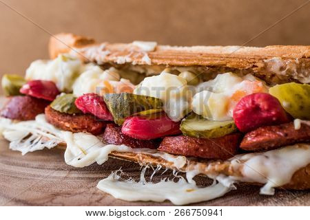 Turkish Toast Ayvalik Tostu / Sandwich With Sausage, Russian Salad, Melted Cheese And Pickle.