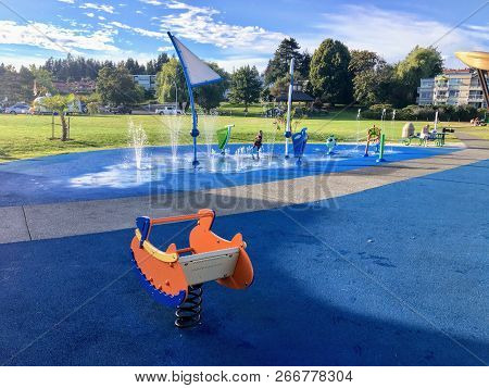 Comox, Canada - August 7th, 2018: A Foreground Photo Of A Blue And Orange Spring Rider At The Local 