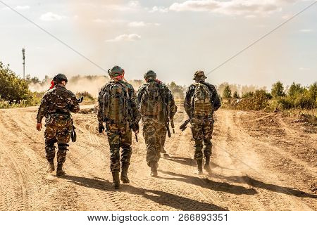 Group Of Soldiers On The Outdoor On Army Exercises. War, Army, Technology And People Concept