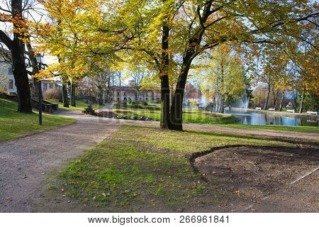 Old City Park At Autumn. Yellow Leafs, And Architecture. Historic Place. Travel Photo 2018.