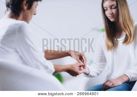 Teenage Girl Having Theta Healing Treatment