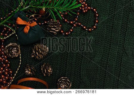 Christmas Gift Decorated With Green Branch, Pine Cone, Gift Bag. Xmas Or New Year Green Background, 
