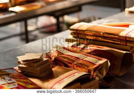 Yunlin, Taiwan - July 13th, 2019: chinese joss gold paper craft on a table at Beigang Chaotian Temple, Yunlin, Taiwan, Asia