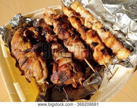 Home Delivery Food. Grilled Chicken, Pork Skewers On Sticks. Food From The Restaurant. Dish In Dispo