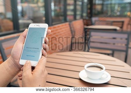 Chiang Mai, Thailand - Feb.17,2020: Man Holding Apple Iphone 8 Plus With Whatsapp Messenger On The S