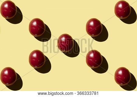 A Lot Of Red Tomato On A Yellow Background View From Above
