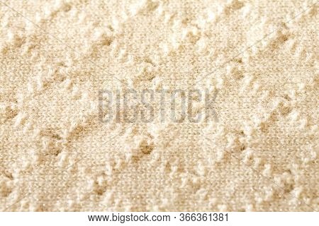 Background Texture Of Rhombus Of White Pattern Knitted Fabric Made Of Cotton Or Wool Closeup