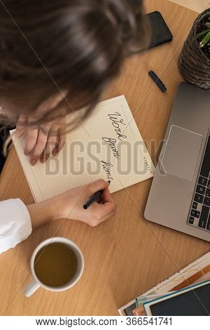 Woman Working On Laptop At Home Office While Drinling Coffee. Web Conection