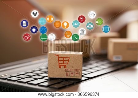 Cardboard Box With Icon On Notebook Keyboard. Online Shopping, E-commerce And Delivery Service Conce