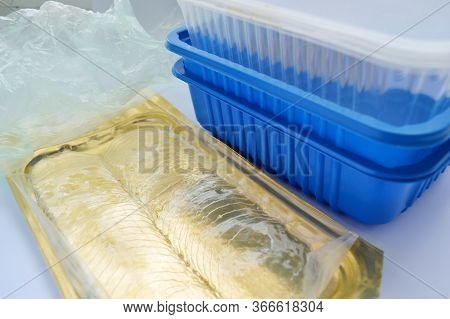 Orange Lid, Transparent And Blue Plastic Container On A White Background. Chemist Day. International