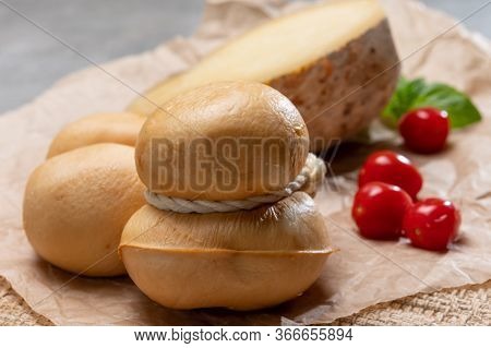 Italian Semi Hard Handmade Smoked Scamorza And Caciocavallo Matured In Caves Cheeses Made From Cow M