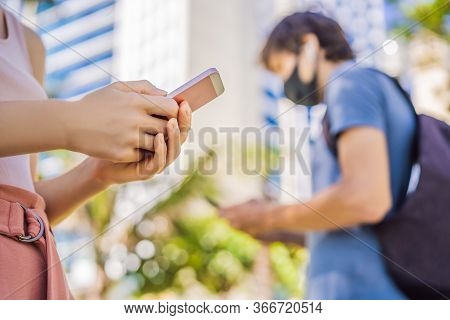 Contact Tracing App Covid-19 Pandemic Coronavirus Mobile Application - People Wearing Face Mask Usin