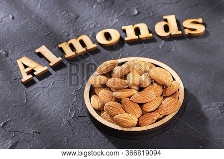 Prunus Dulcis - Peeled Almonds. Almonds Word In Wooden Letters
