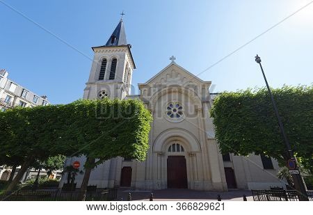 Saint Justin Catholic Church: Religious Building In Neo-medieval Style With Bell Tower And Spire. Le