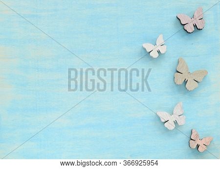 Srpingtime Background With Wooden Butterflies Imitation On Blue
