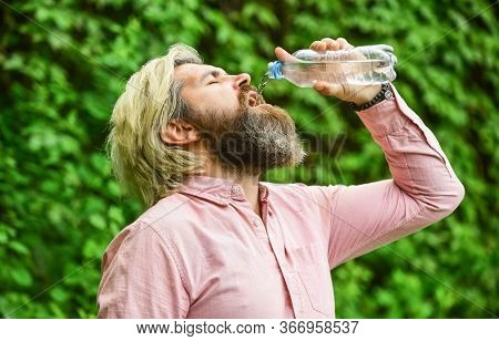 Another Sip. Handsome Man Drinking Fresh Water From Bottle. Morning Routine. Daily Intake Of Water. 