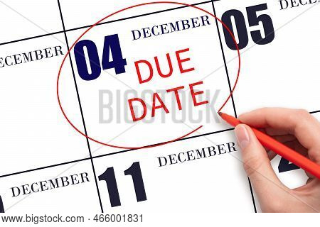 4th Day Of December. Hand Writing Text Due Date On Calendar Date December 4 And Circling It. Payment