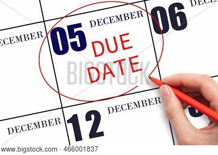 5th Day Of December. Hand Writing Text Due Date On Calendar Date December 5 And Circling It. Payment