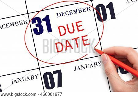 31st Day Of December. Hand Writing Text Due Date On Calendar Date December 31 And Circling It. Payme