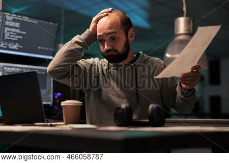 Tired Software Developer Working Late After Hours, Feeling Under Pressure To Meet Deadline. Using Ht