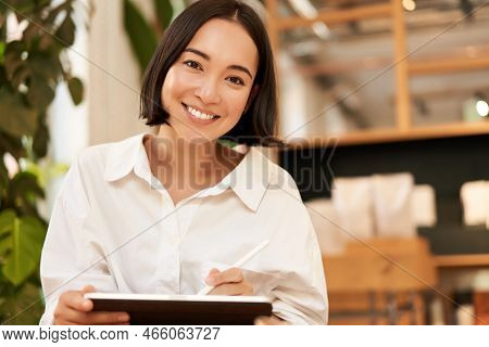 Young Beautiful Artist, Woman Drawing On Tablet With Graphic Pen, Smiling Happily