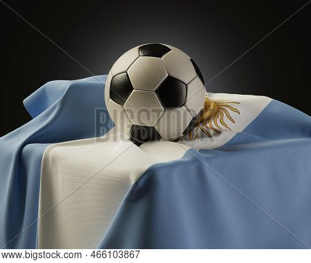 A Regular Soccer Balls Resting On An Argentina Flag Draped Over A Plinth On An Isolated Studio Backg