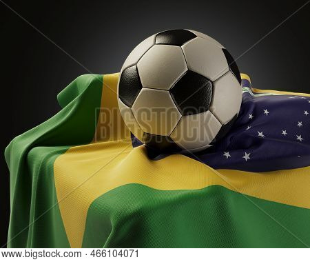 A Regular Soccer Balls Resting On A Brazil Flag Draped Over A Plinth On An Isolated Studio Backgroun