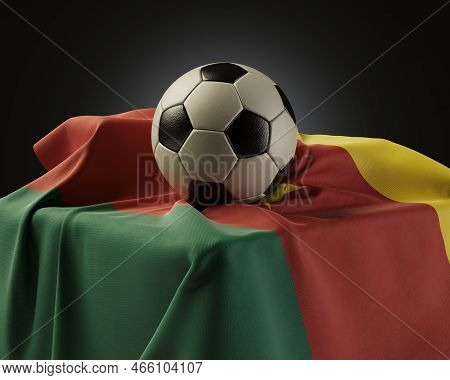 A Regular Soccer Balls Resting On A Cameroon Flag Draped Over A Plinth On An Isolated Studio Backgro