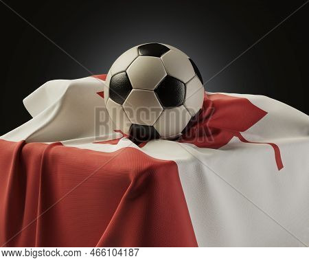 A Regular Soccer Balls Resting On A Canada Flag Draped Over A Plinth On An Isolated Studio Backgroun