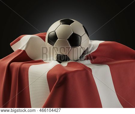 A Regular Soccer Balls Resting On A Denmark Flag Draped Over A Plinth On An Isolated Studio Backgrou