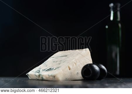 French Cheese, Roquefort With Olives On Plate, Closeup. French Roquefort Cheese With Olives On A Dar