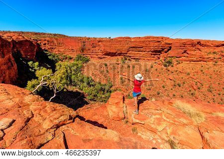 Hiking Woman With Open Arms At The Edge Of Kings Canyon. Enjoying In Red Center Outback. Sandstone F