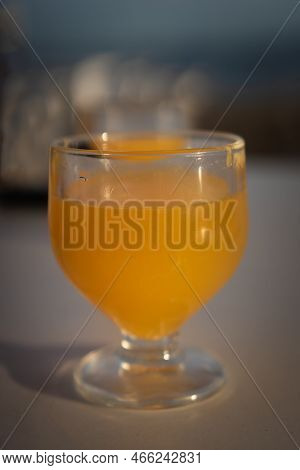 A Glass Of Poncha, A Traditional Beverage From Madeira Island Made With Citrus, Honey And Regional S