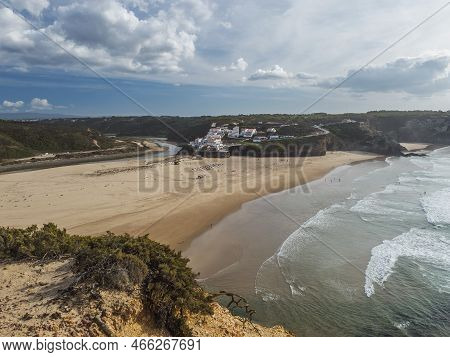 Panoramic View Of Praia De Odeceixe Mar Surfer Beach With Golden Sand, Atlantic Ocean Waves, River B