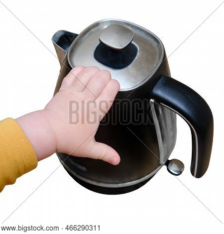 Toddler Baby Boy Holds A Hot Kettle With Boiling Water, Isolated On A White Background. Child Safety