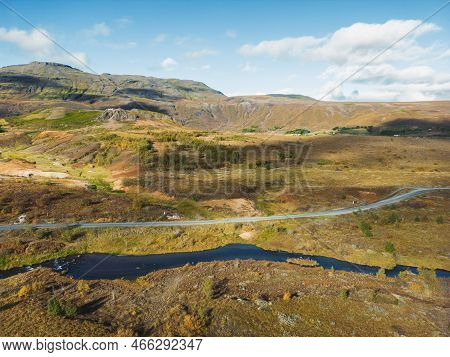 Lonely Road And A River Running By In Mainland Iceland
