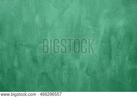 Aged Green Weathered Textured Background With Brush Strocks Or Grunge Rough Surface Backdrop.