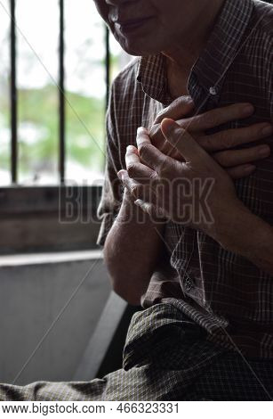 Asian Elder Man Suffering From Central Chest Pain. Chest Pain Can Be Caused By Heart Attack, Myocard